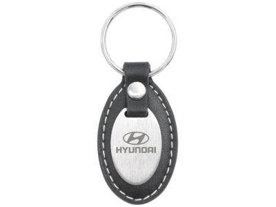Hyundai Leather oval w/ an oval metal plaque on the front 00402-24410